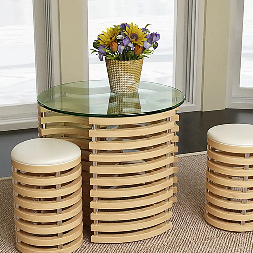 Round tempered glass table with polished edge and matching stools for elegant dining