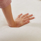 Hand pressing into soft white mattress on Beige Linen Sofa with sturdy wood frame, package size