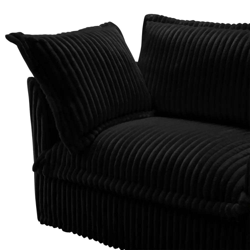 Black corduroy deep seat modern sofa with cushions in contemporary living room