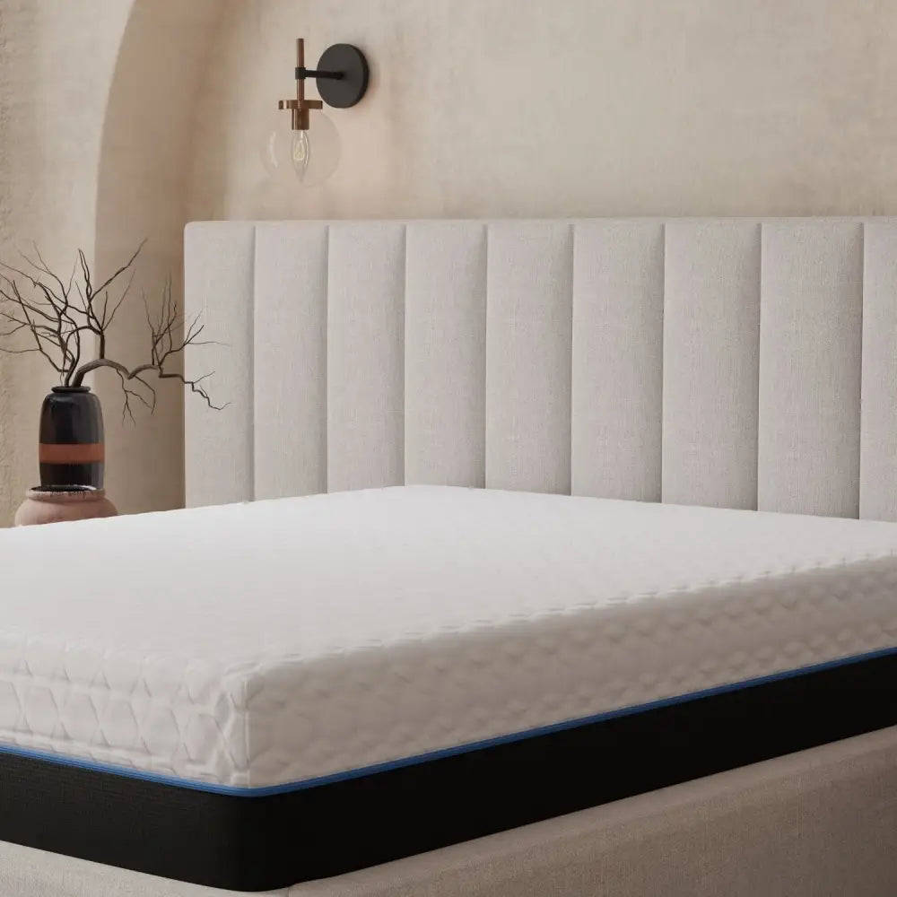 California king white mattress with black and blue trim featuring memory comfort layer