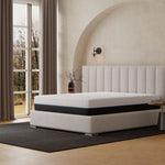 White mattress with comfort layer on California King platform bed for optimal sleep