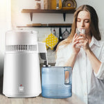 White water distiller with stainless steel construction and blue collection container for efficient heat dissipation