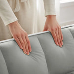 Gray padded mattress with white trim on Grey Velvet Chair Bed Sleeper for Small Spaces