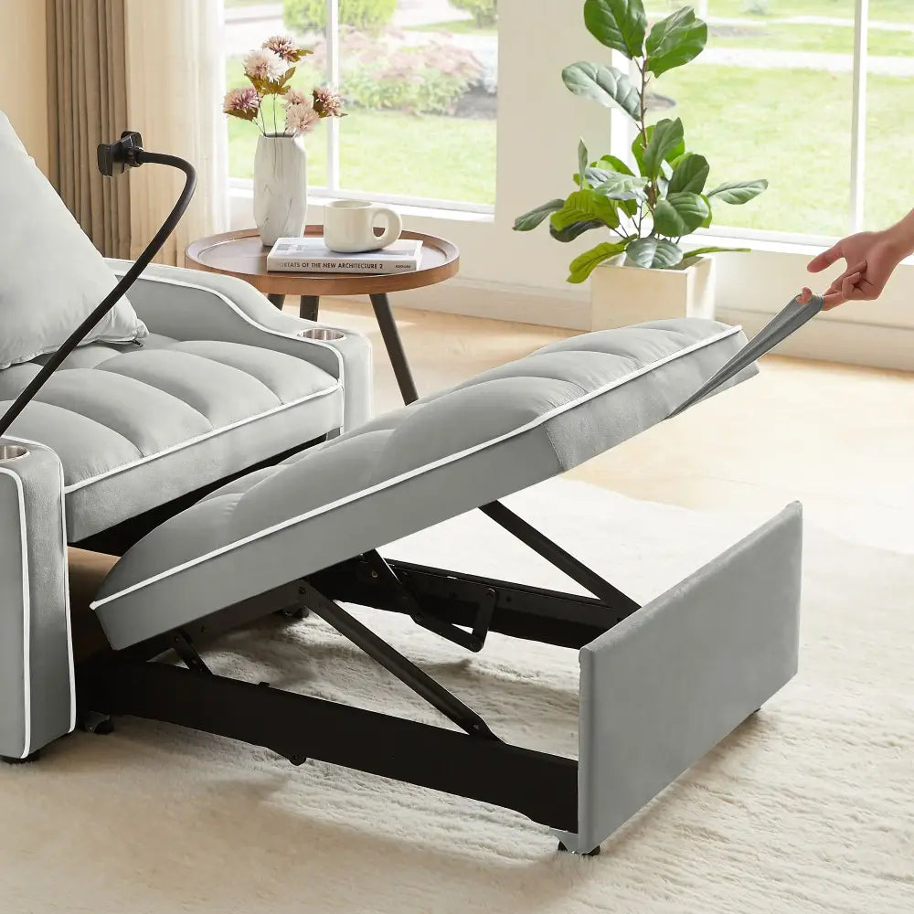 Gray recliner chair bed with extended footrest, perfect for small spaces