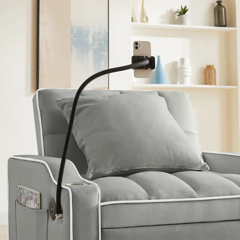 Gray chaise lounge with phone holder from Grey Velvet Chair Bed Sleeper for Small Spaces