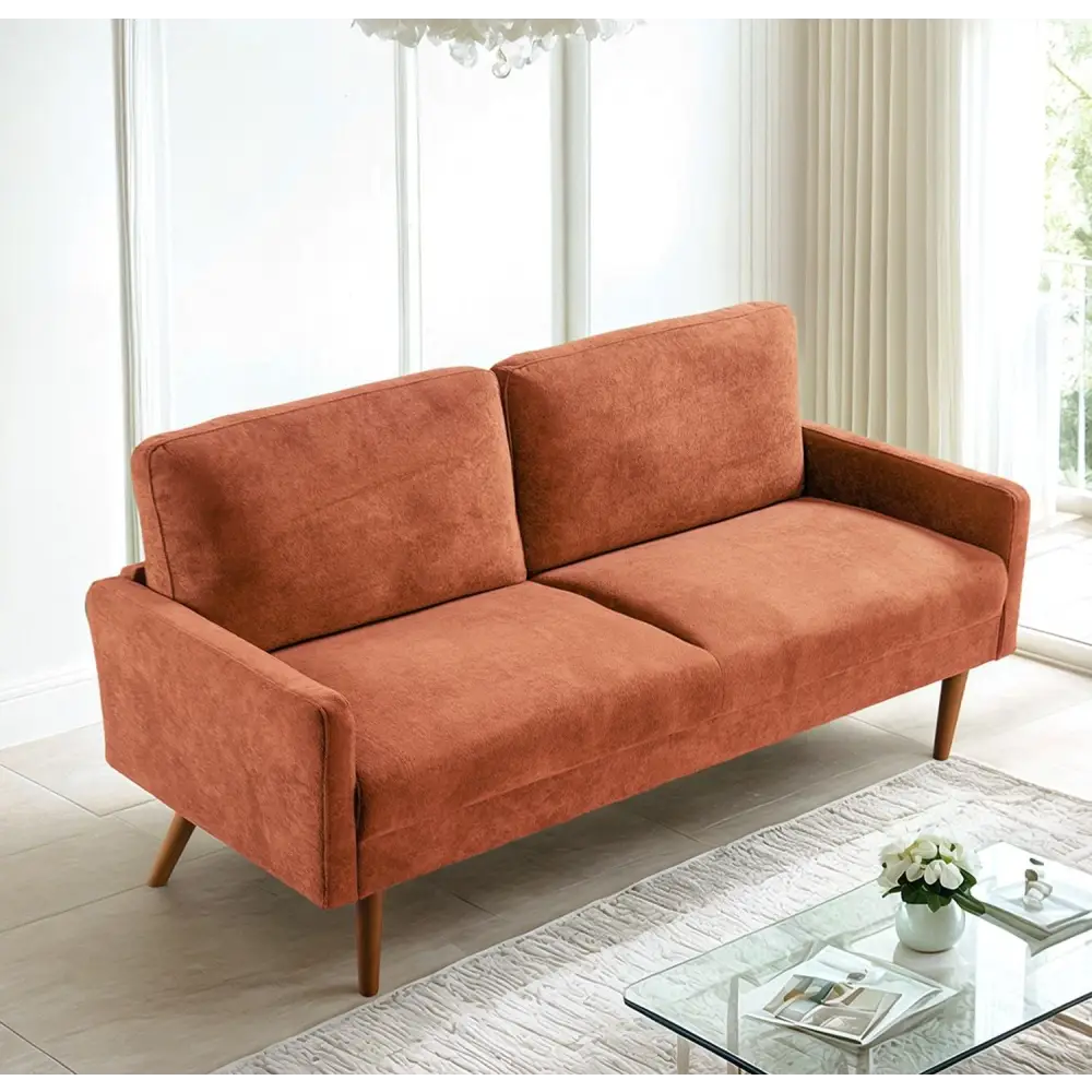 Orange two-cushion velvet couch for a chic living room in Kent Pumpkin Orange Velvet Couch Chic Living Room