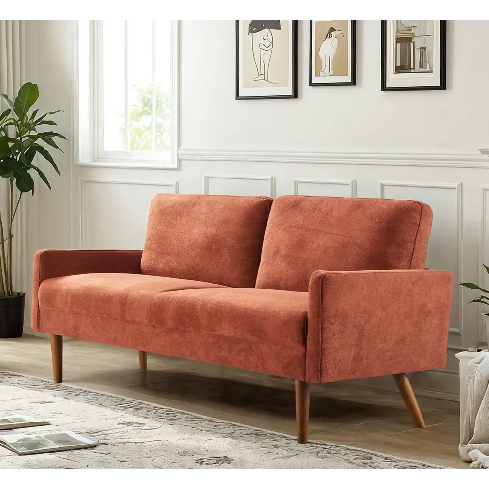 Orange velvet couch with wooden legs for chic living room decor and stylish living room furniture