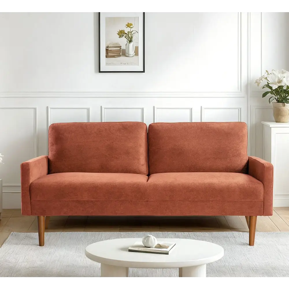 Velvet couch with wooden legs for chic living room decor in the Kent Pumpkin Orange collection