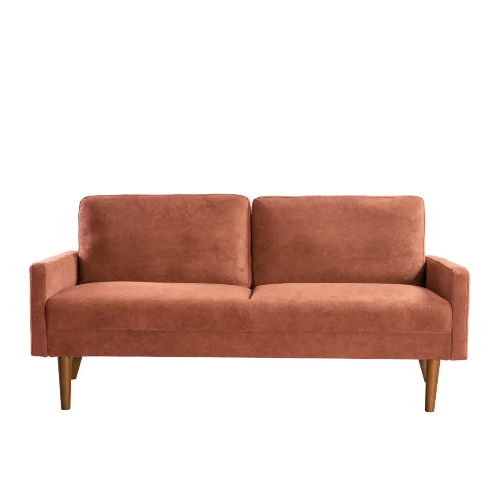 Two-cushion copper-colored velvet couch in chic living room setting