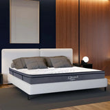 White bed with Gray Mattress showcasing King 14 Inch Plush Hybrid Mattress with Multiple Foam Layers