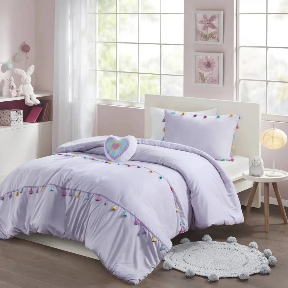Lavender tassel-trimmed bedding with heart shaped throw pillow and shaped throw pillow