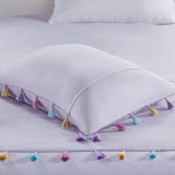 White pillow with colorful tassels from Lavender Tassel Comforter with Heart Shaped Throw Pillow Set