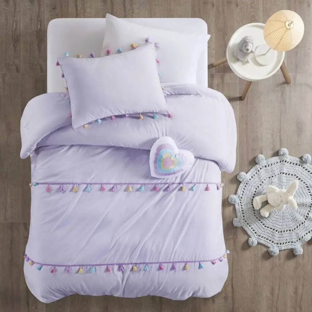Lavender tassel-trimmed bedding with heart shaped throw pillow set for elegant bedroom decor