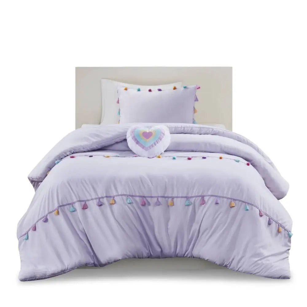 Lavender tassel-trimmed bedding set with heart shaped throw pillow for elegant bedroom decor