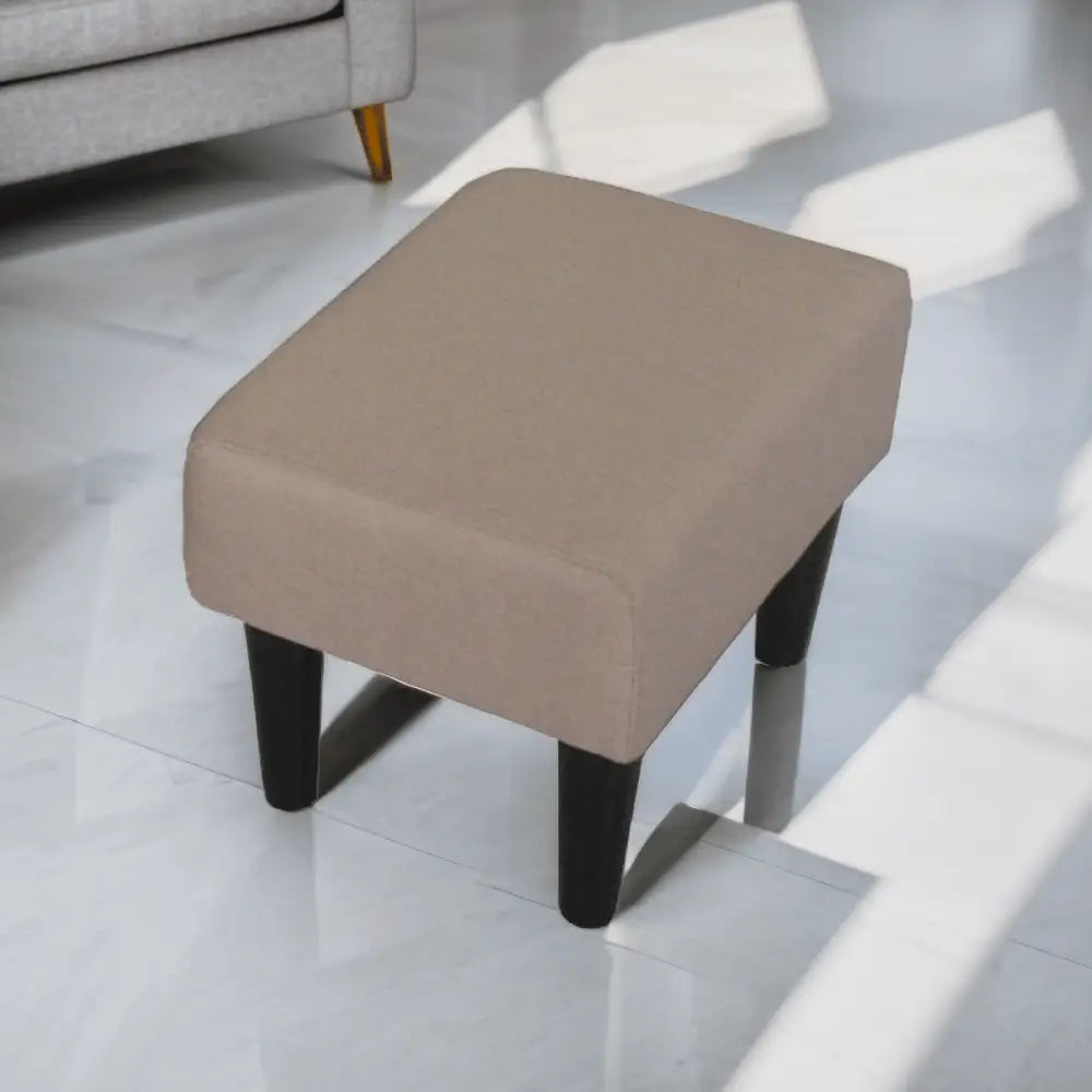 Beige upholstered ottoman with dark legs, ideal for modern living room single chairs