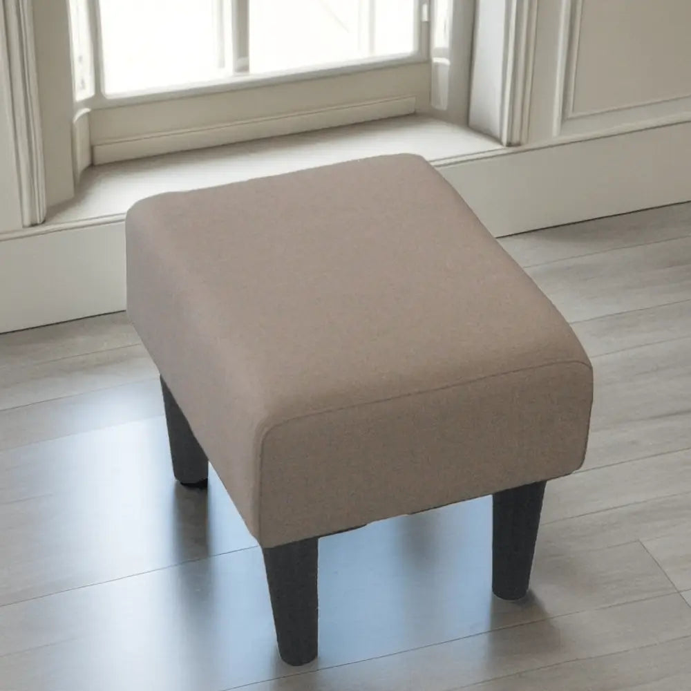 Upholstered ottoman with dark legs for Modern Living Room Single Chair in a stylish living room