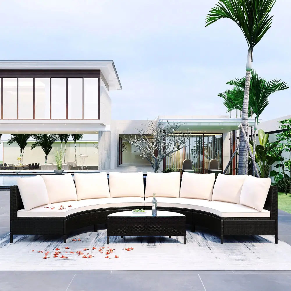 Wicker outdoor sectional sofa set with glass table for patio lounging and entertaining