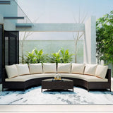 Curved wicker sectional sofa set with cushions and glass table for outdoor patio use