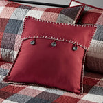 Maroon reversible daybed cover with button accents and white stitching details