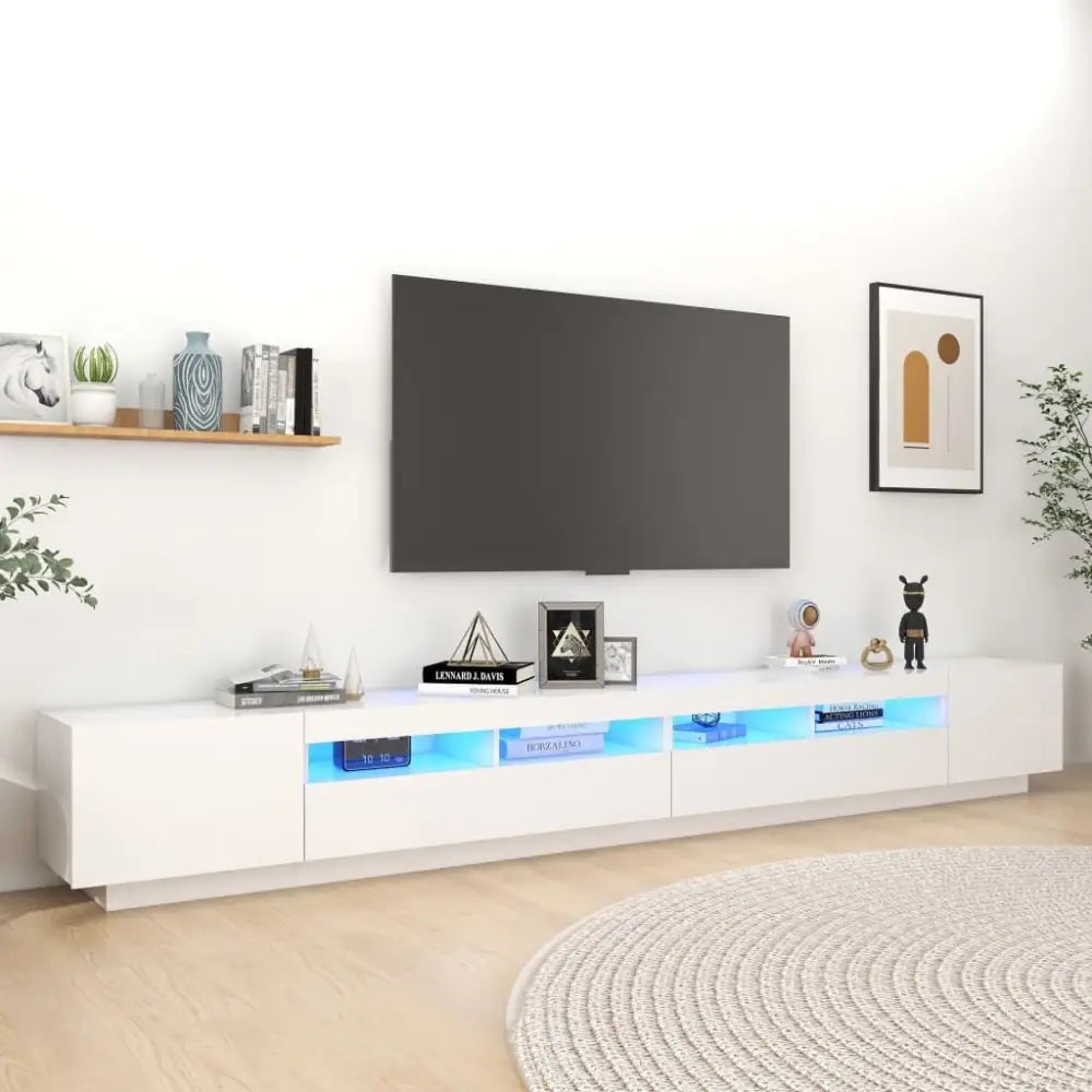 White TV stand with LED lights featuring RGB lighting for modern home entertainment