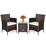 Wicker patio furniture set with coffee table and floral centerpiece showcasing durability and style