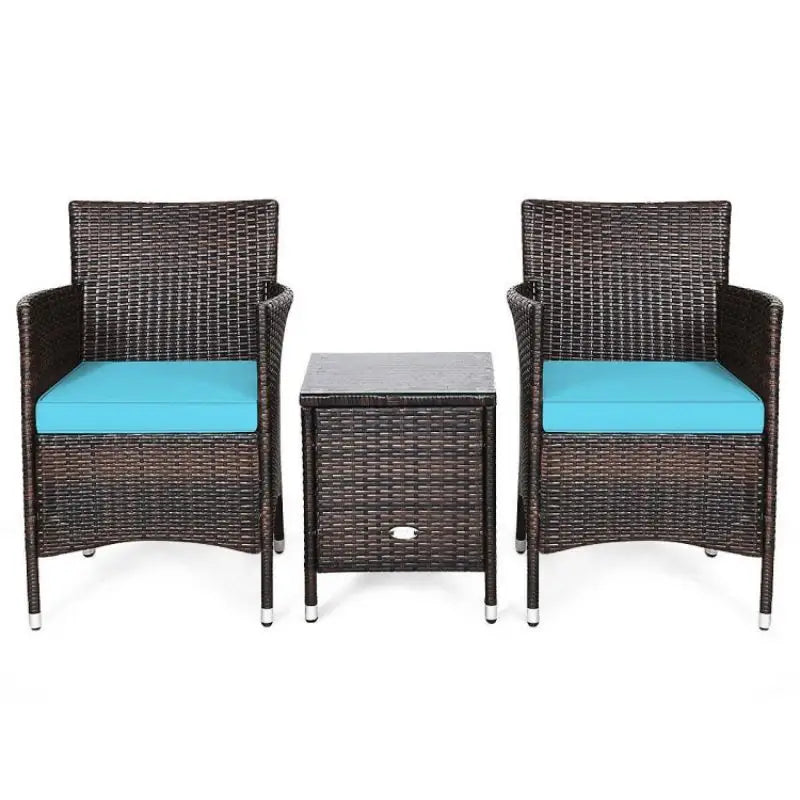 Wicker patio furniture set with blue cushions and coffee table for outdoor relaxation